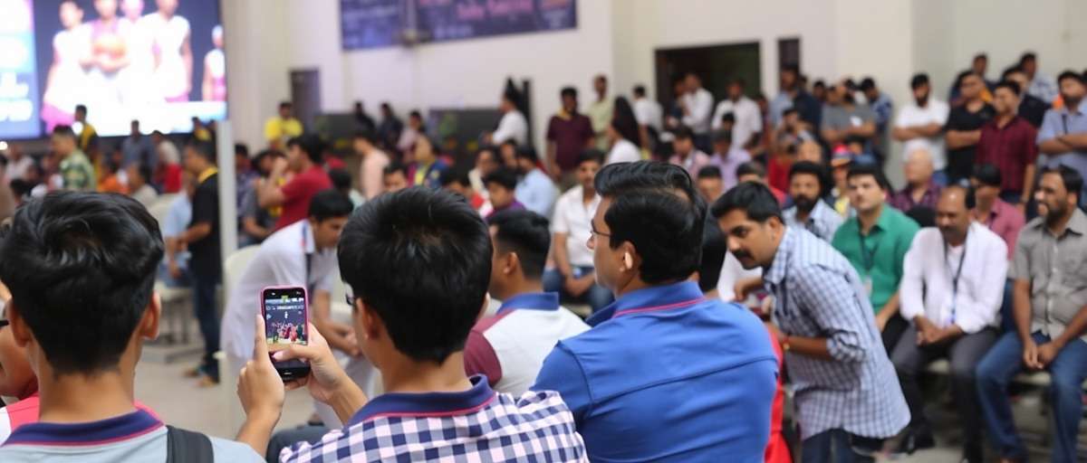 Basketball Bonanza live tournament in India showing players competing on mobile devices with a large crowd of spectators